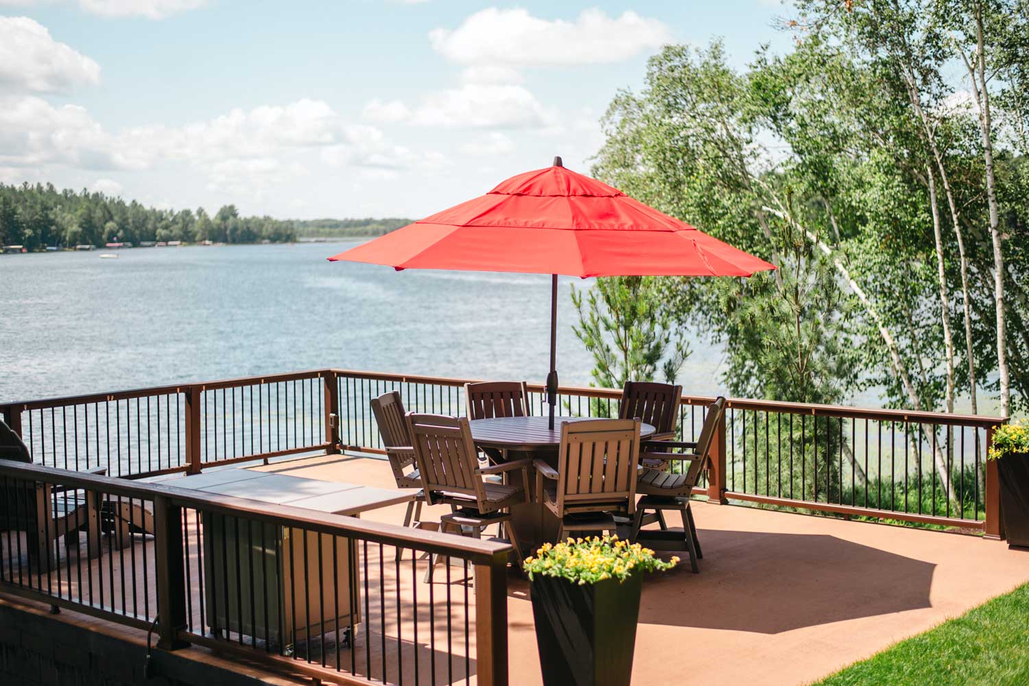photo of an outdoor dining set with an umbrella