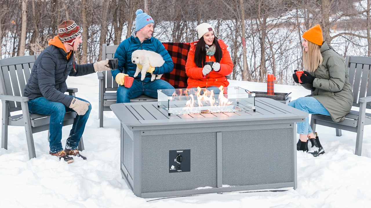 Friends gathered around a By the Yard fire table