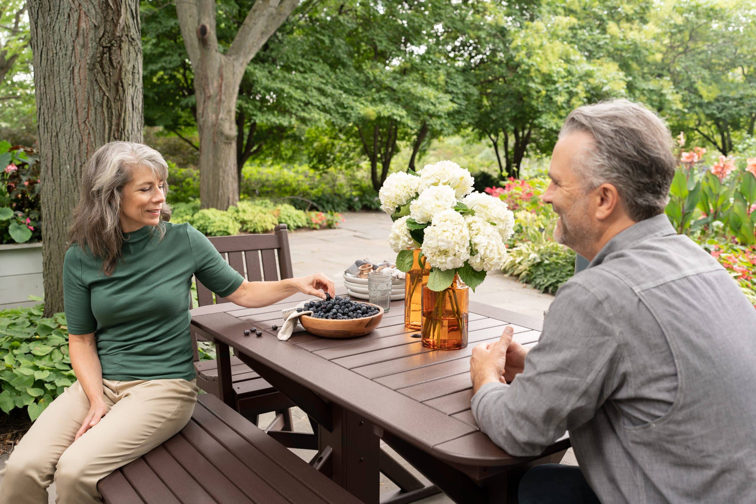 Couple sitting at a By the Yard HDPE table