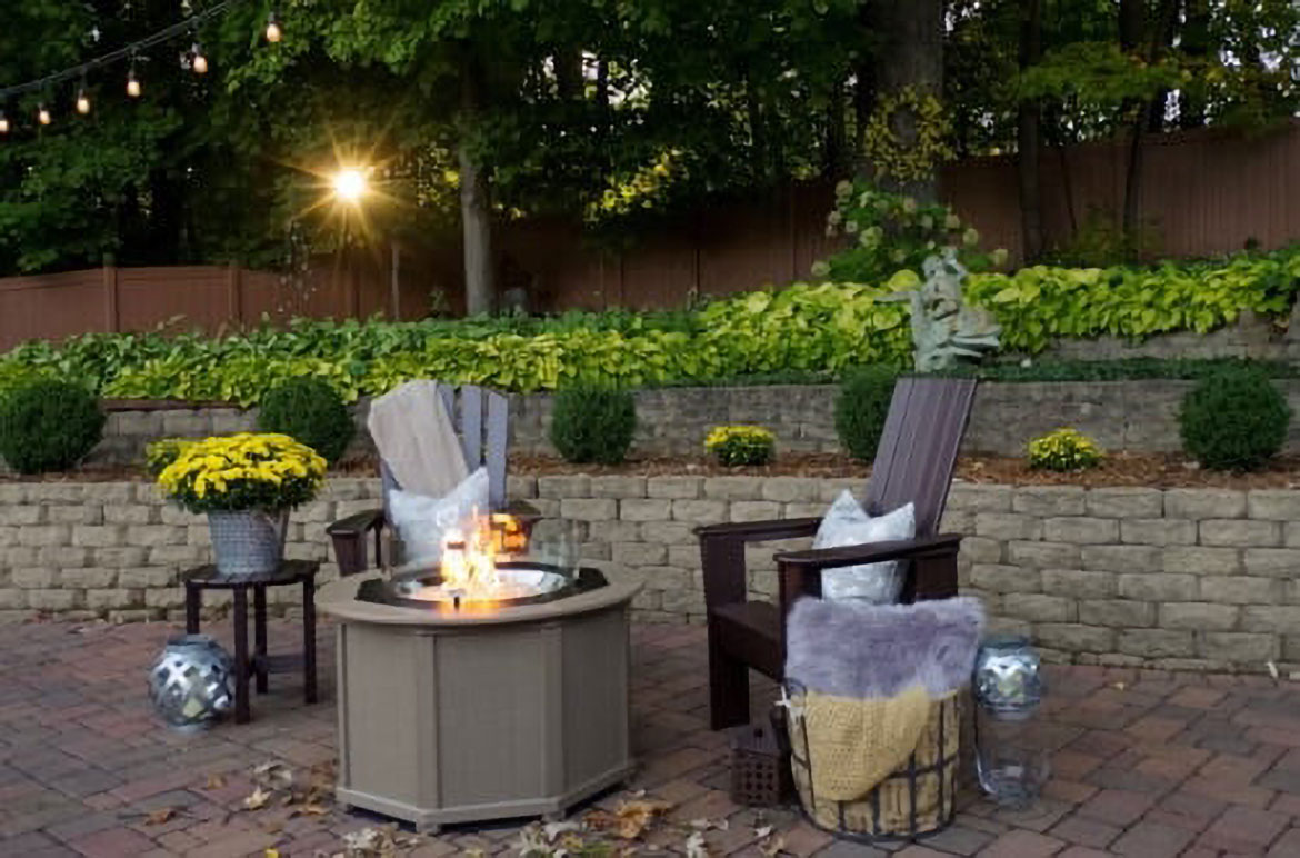 by the yard fire table and chairs