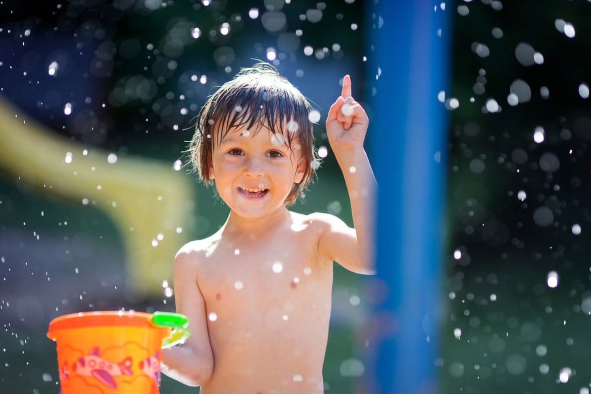 boy playing with water